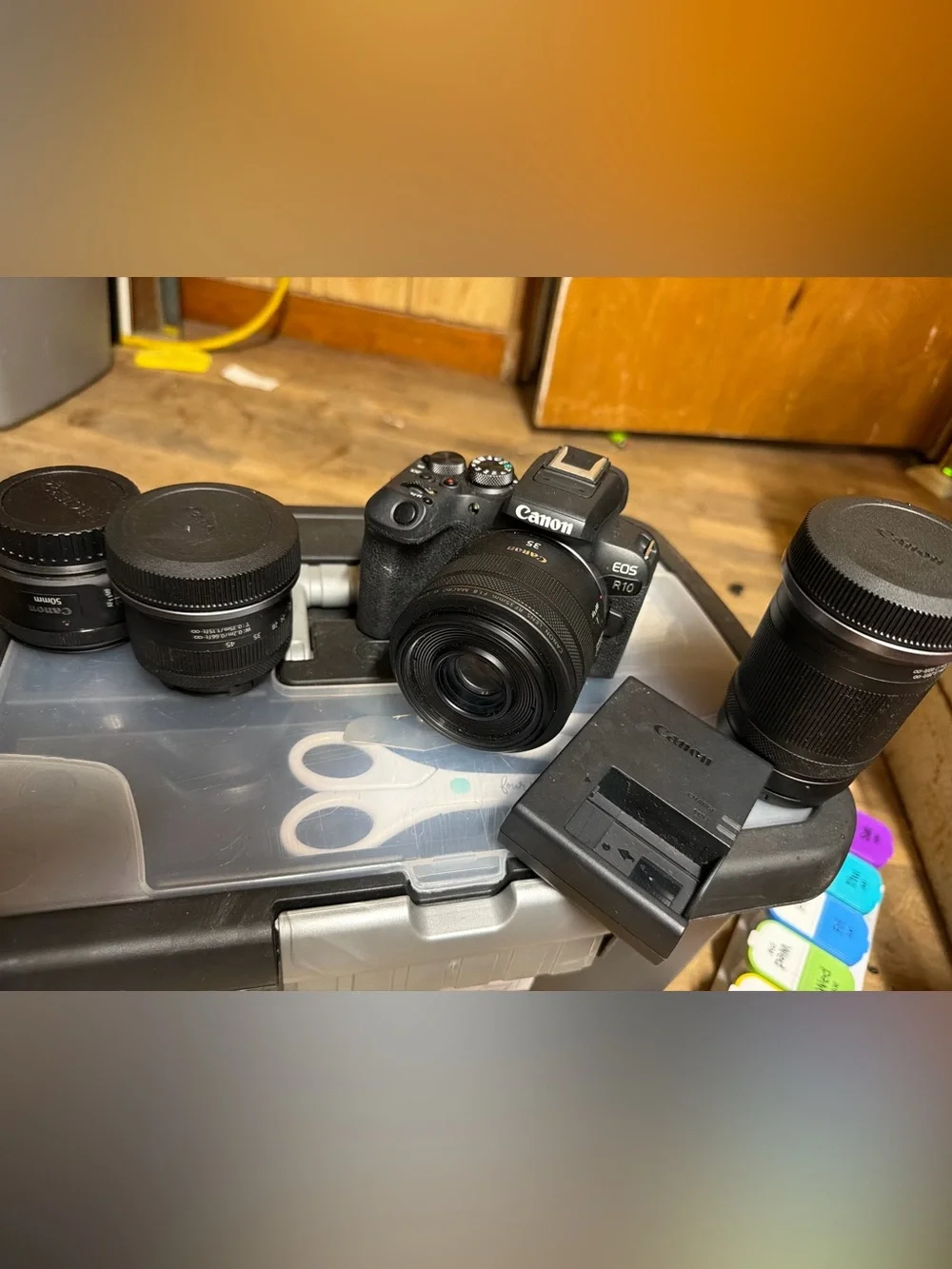 Canon EOS R10 Compact Mirrorless Camera with Multiple Black Lenses and Charger